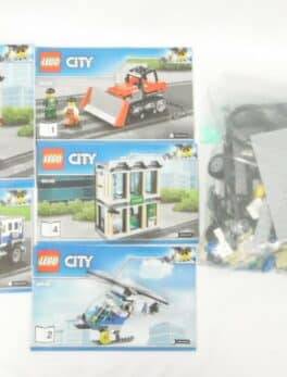 Lego City - N° 60140 - Le cambriolage de la Banque Produit d'occasion Sans boite / avec notice / 100% Lego 560 pièces / 5 Mini-figurines /Année 2017